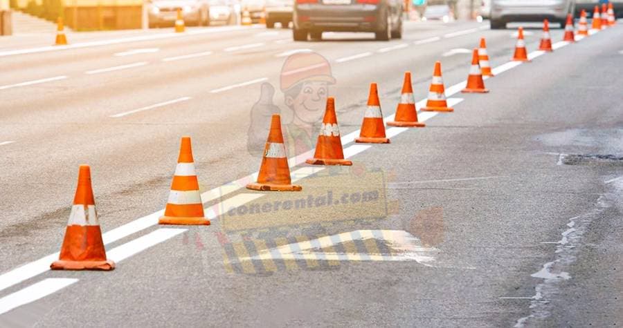 Traffic cones closing a lane on a live road