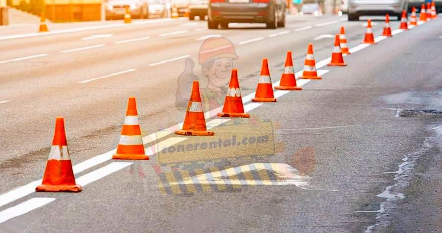 Traffic cones closing a lane on a live road